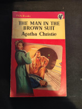 The man in the brown suit